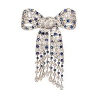 EVELYN CLOTHIER, DIAMOND AND SAPPHIRE BOW BROOCH
