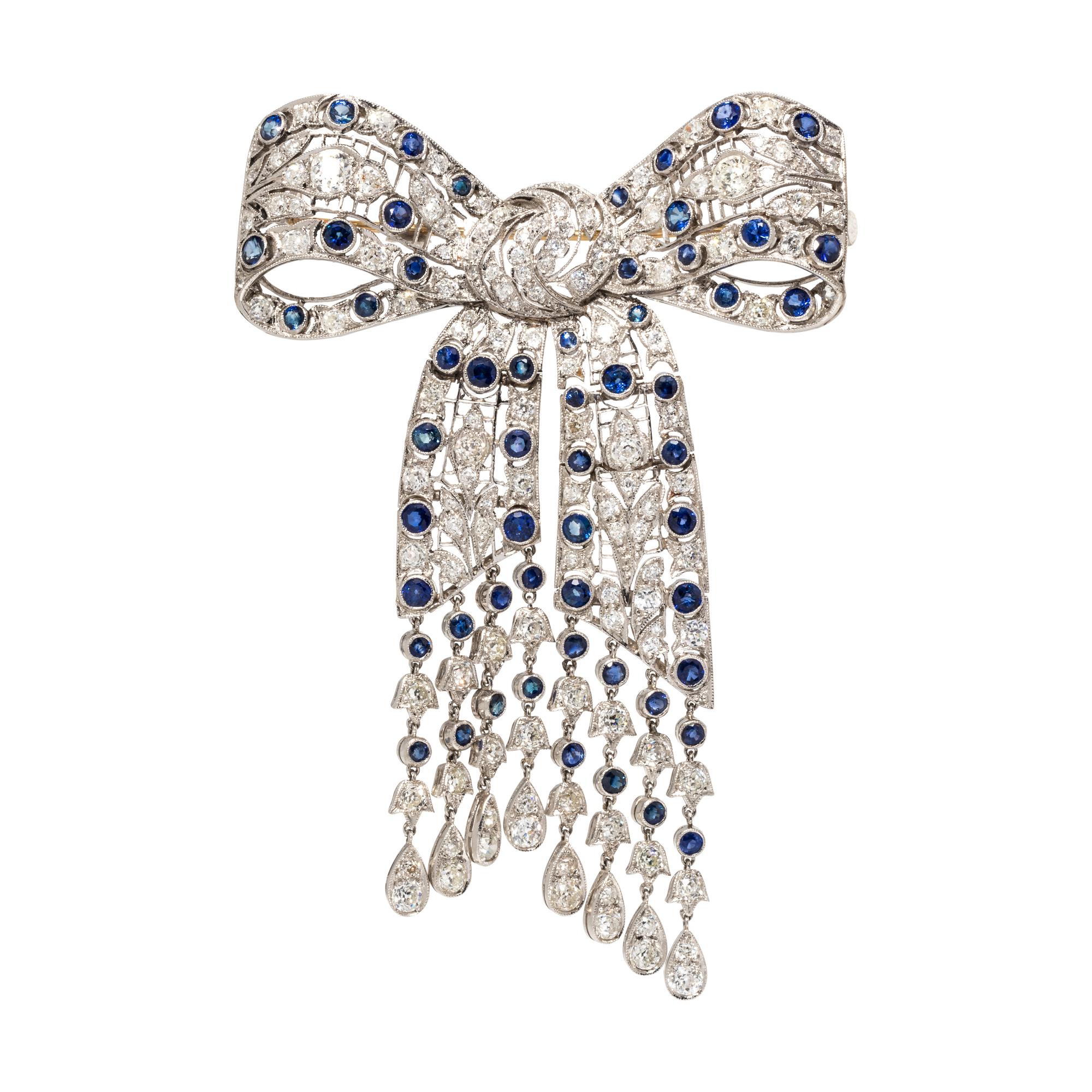 EVELYN CLOTHIER, DIAMOND AND SAPPHIRE BOW BROOCH