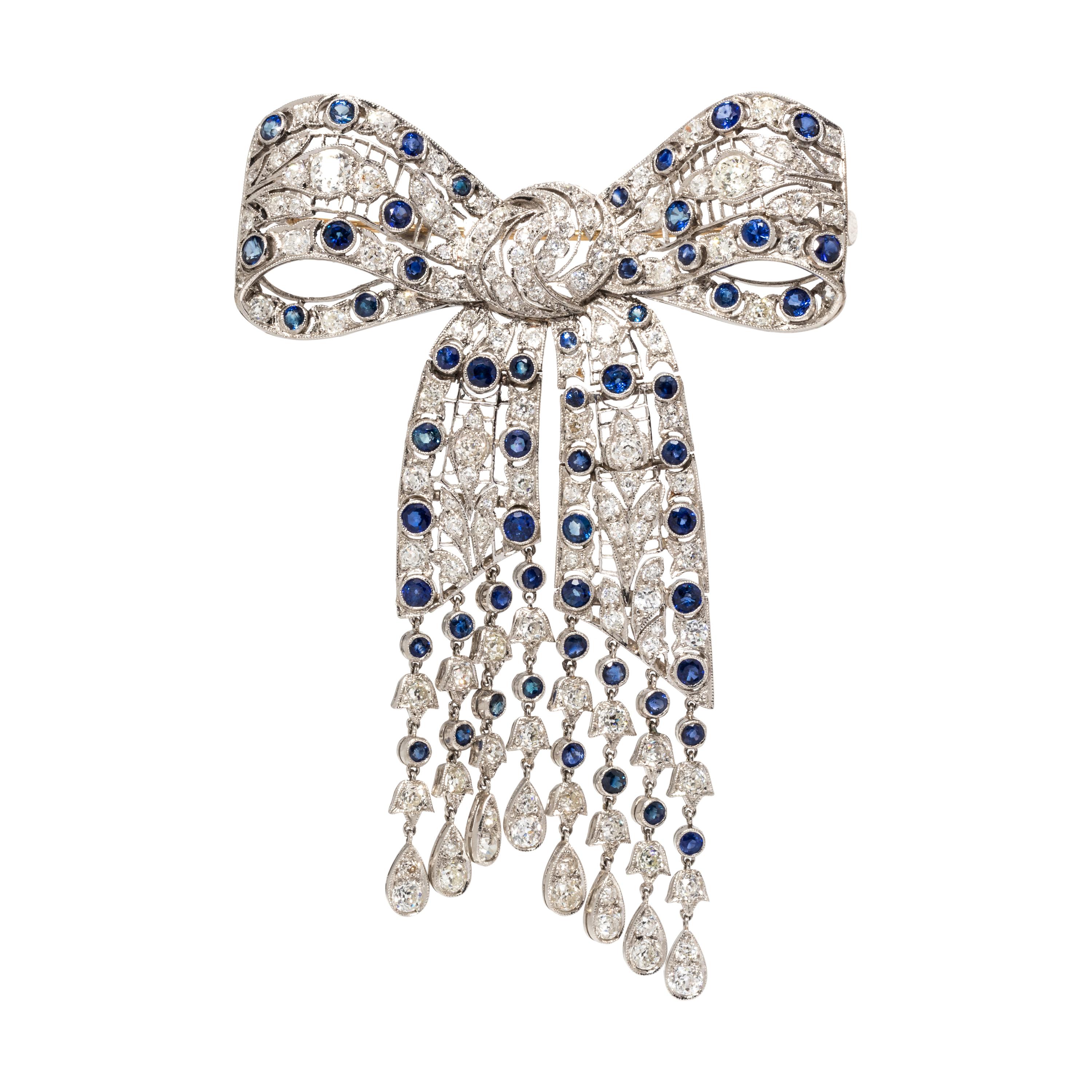 EVELYN CLOTHIER, DIAMOND AND SAPPHIRE BOW BROOCH