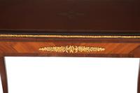 A Louis XV Style Gilt Bronze Mounted Kingwood and Mahogany Writing Table