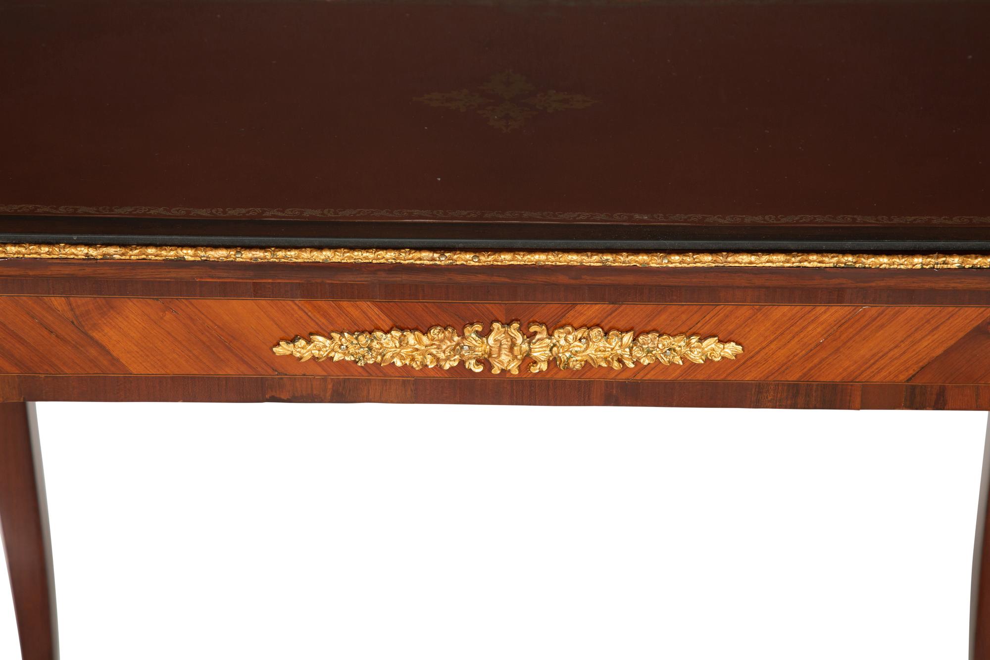 A Louis XV Style Gilt Bronze Mounted Kingwood and Mahogany Writing Table