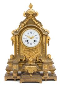 A Louis XVI Style Gilt Metal Mantel Clock Height 15 inches. — 19TH CENTURY