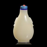 A Chinese Carved White and Russet Jade Snuff Bottle