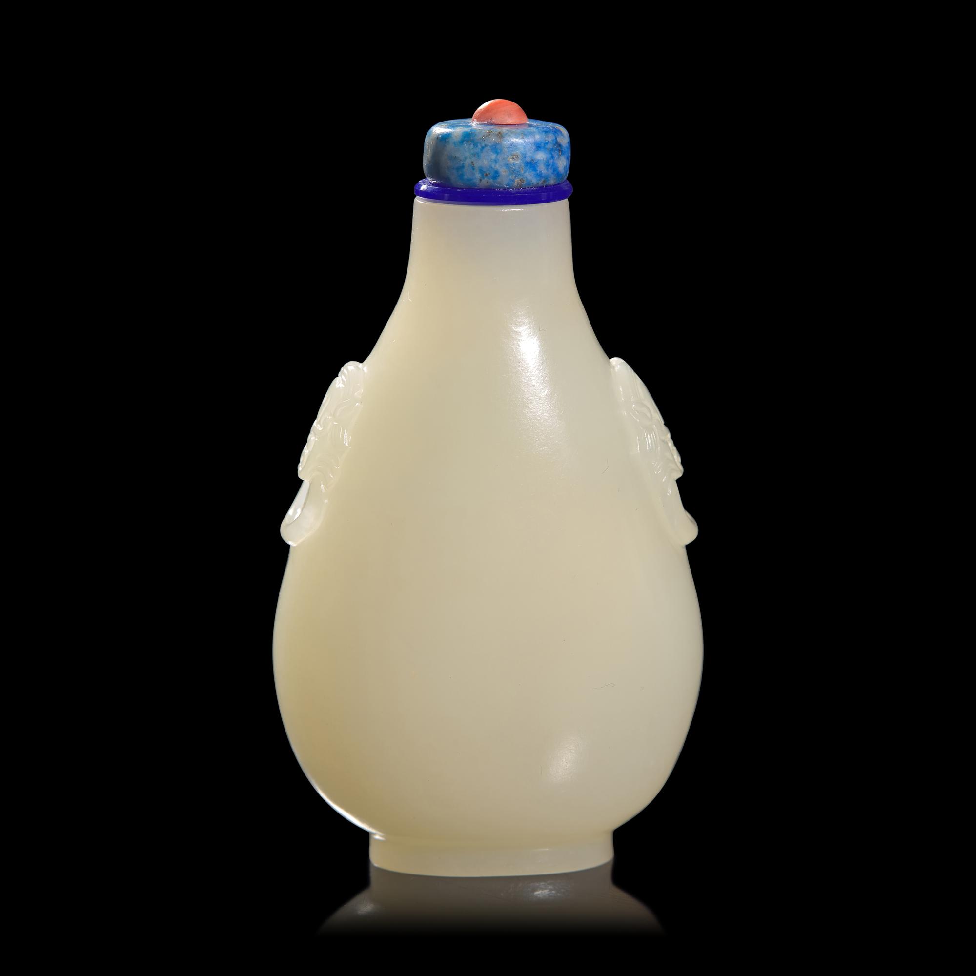 A Chinese Carved White and Russet Jade Snuff Bottle