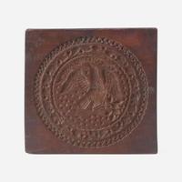 A carved mahogany cake board Stamped J. Conger and J.Y. Watkins, New York