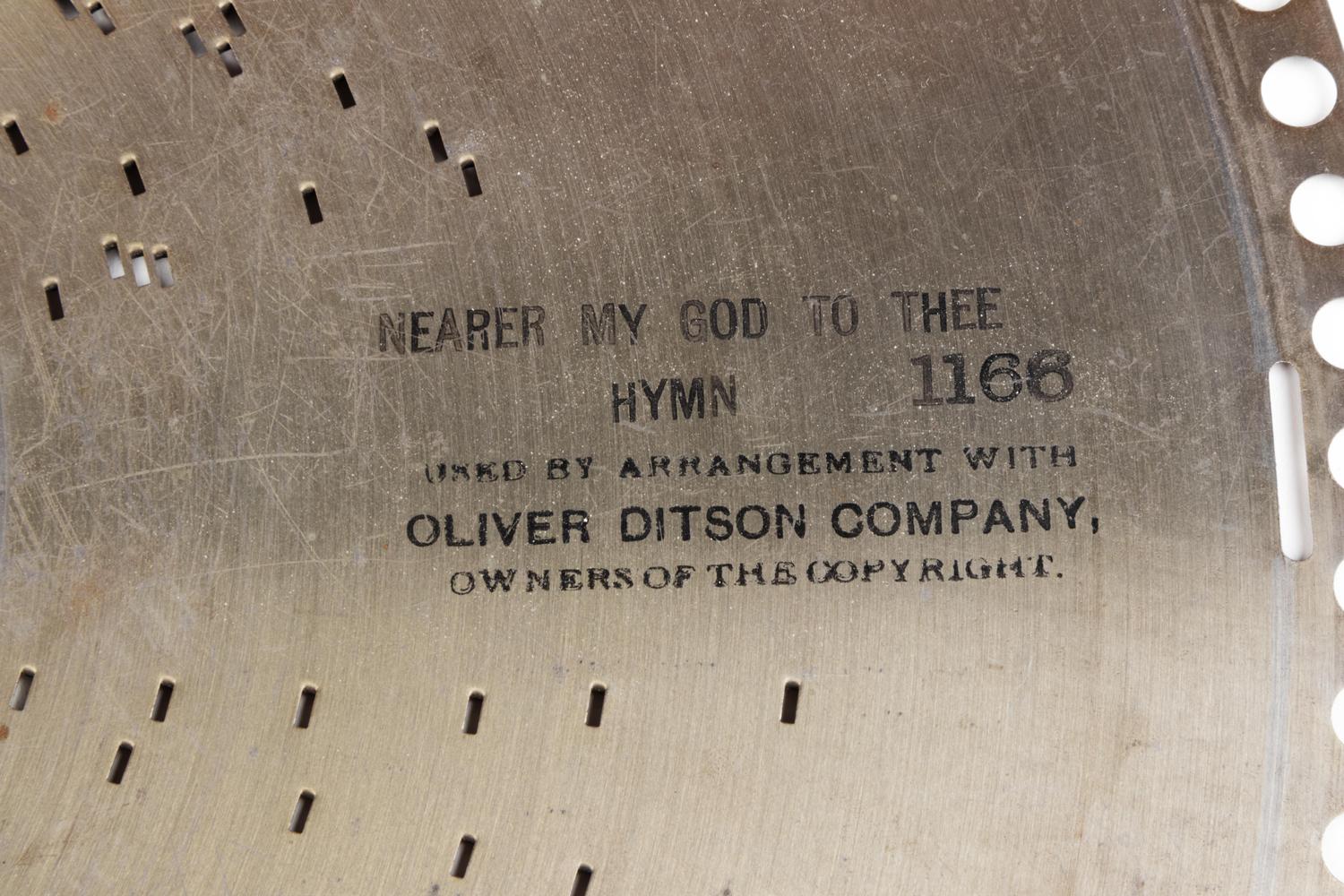 A Regina 15 1/2-Inch Double-Comb Disk Oak Music Box