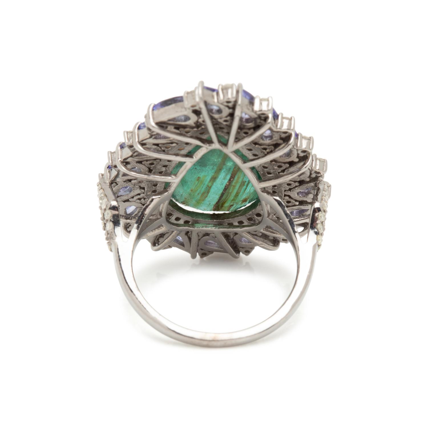 EMERALD, TANZANITE AND DIAMOND RING