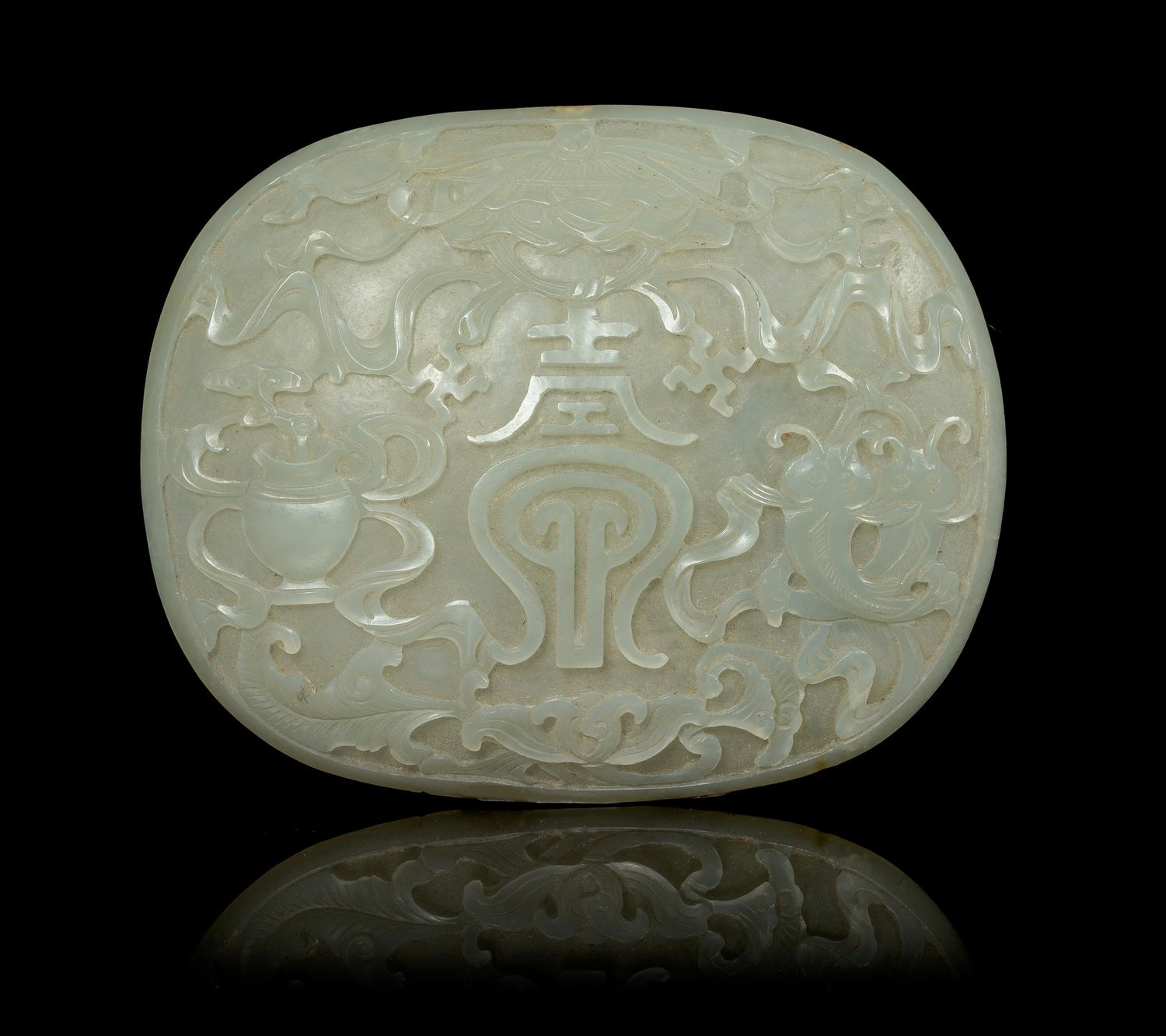 A Celadon Jade Oval Plaque Length 3 3/4 inches. — 19TH CENTURY