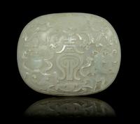 A Celadon Jade Oval Plaque Length 3 3/4 inches. — 19TH CENTURY