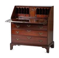 A Chippendale Figured and Shell-Carved Mahogany Slant Front Desk