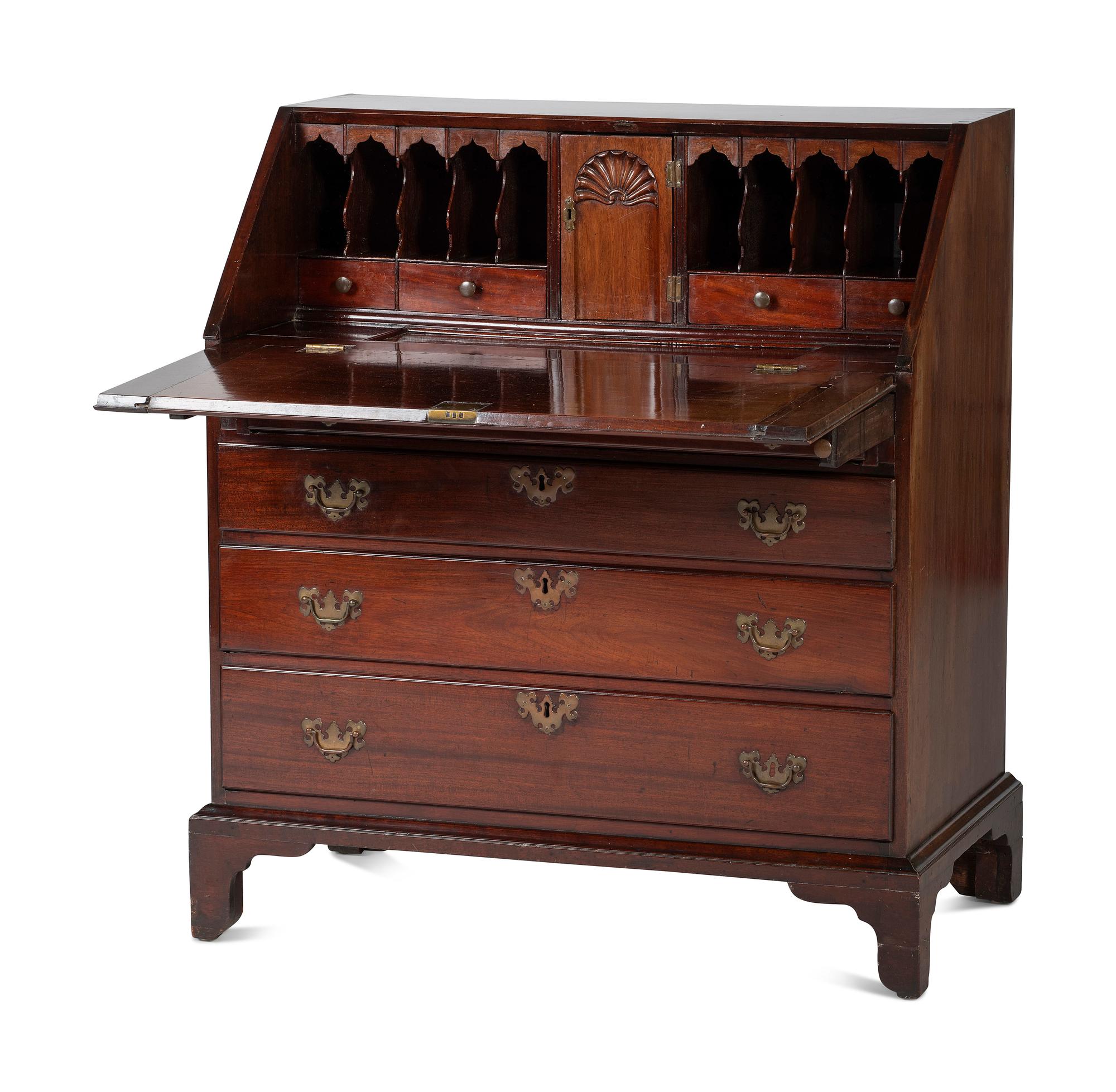 A Chippendale Figured and Shell-Carved Mahogany Slant Front Desk