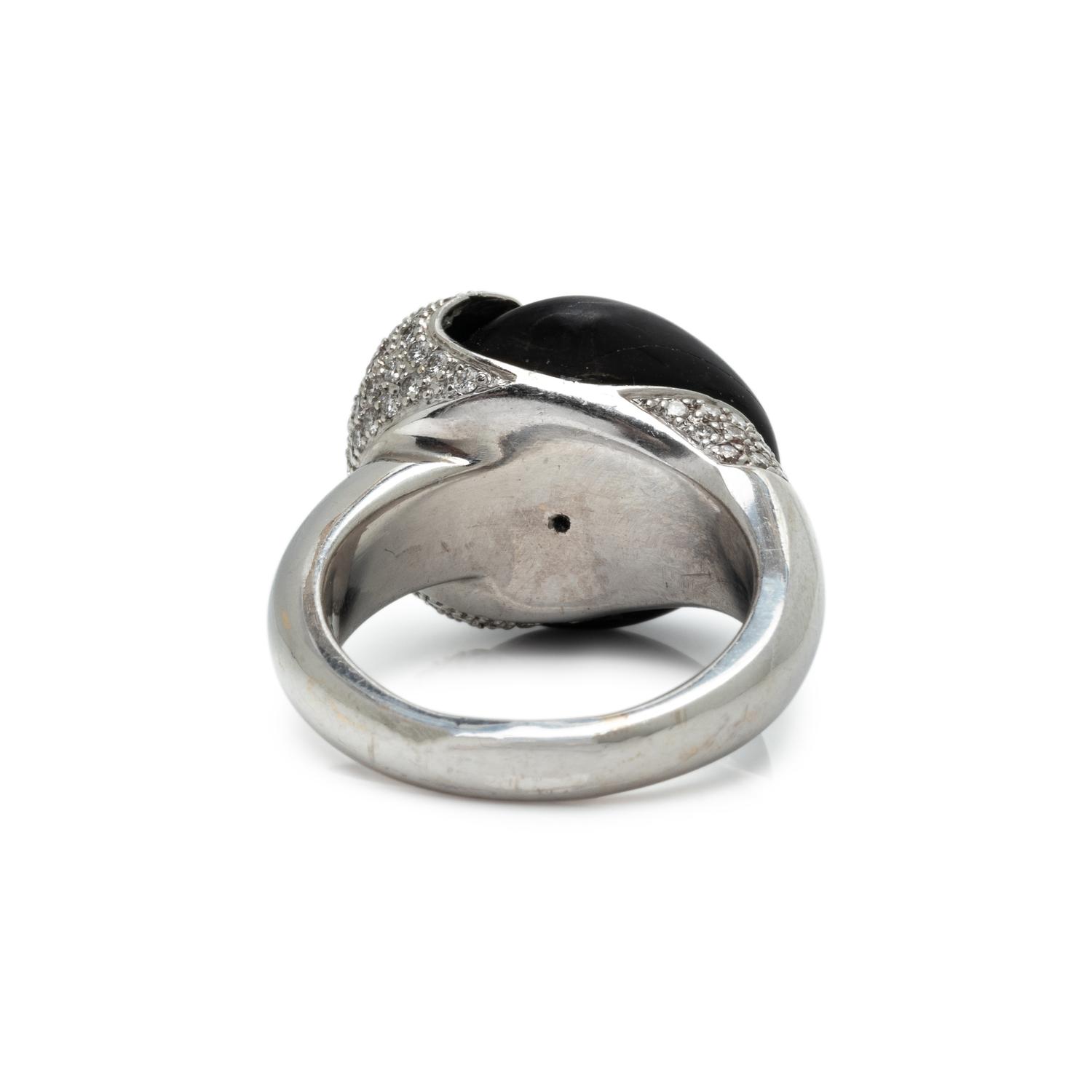 MOVADO, WHITE GOLD, PEBBLE AND DIAMOND SET