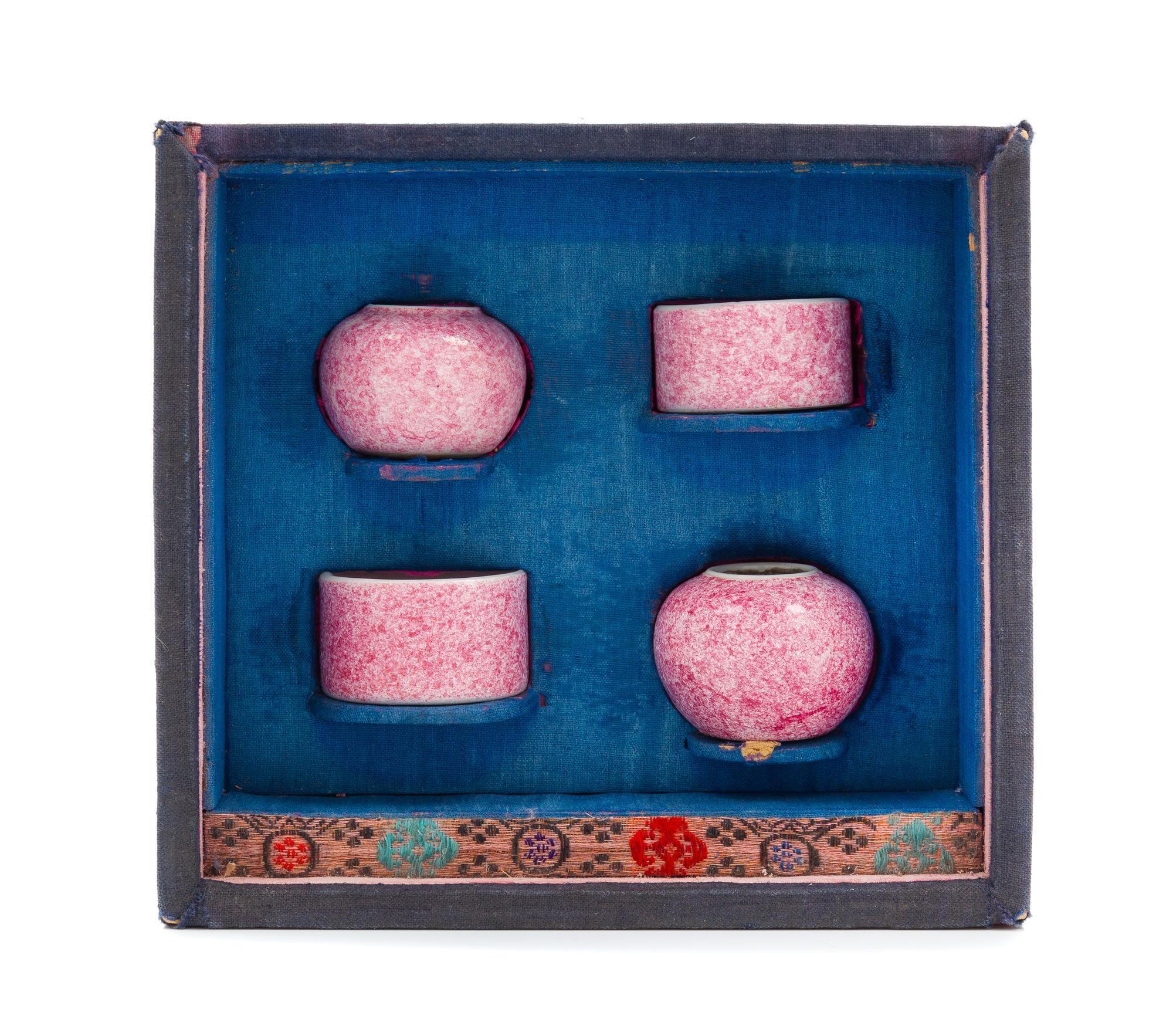 A Set of Four Chinese Pink Glazed Porcelain Bird Feeders Diameter of largest 1 3/4 inches. — 19TH CENTURY