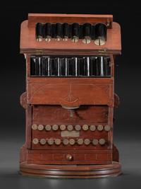 A Carved Wood Change Machine