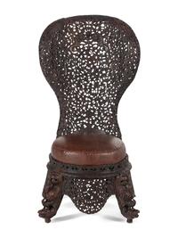An Anglo-Indian Carved Hardwood Slipper Chair