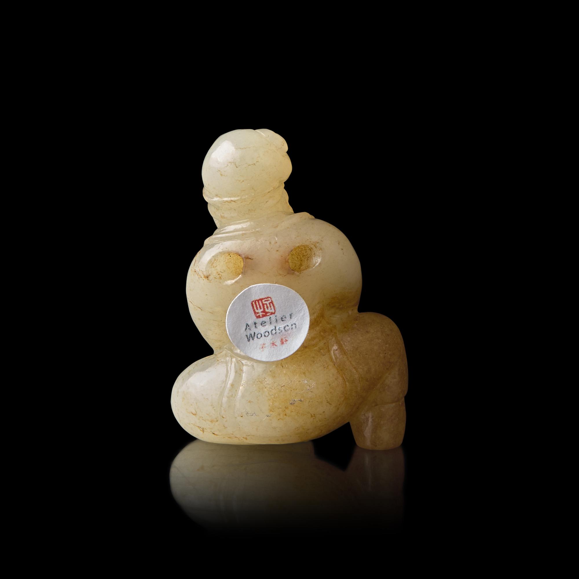 A Chinese Russet and White Jade Carved Foreigner 白玉帶沁胡人