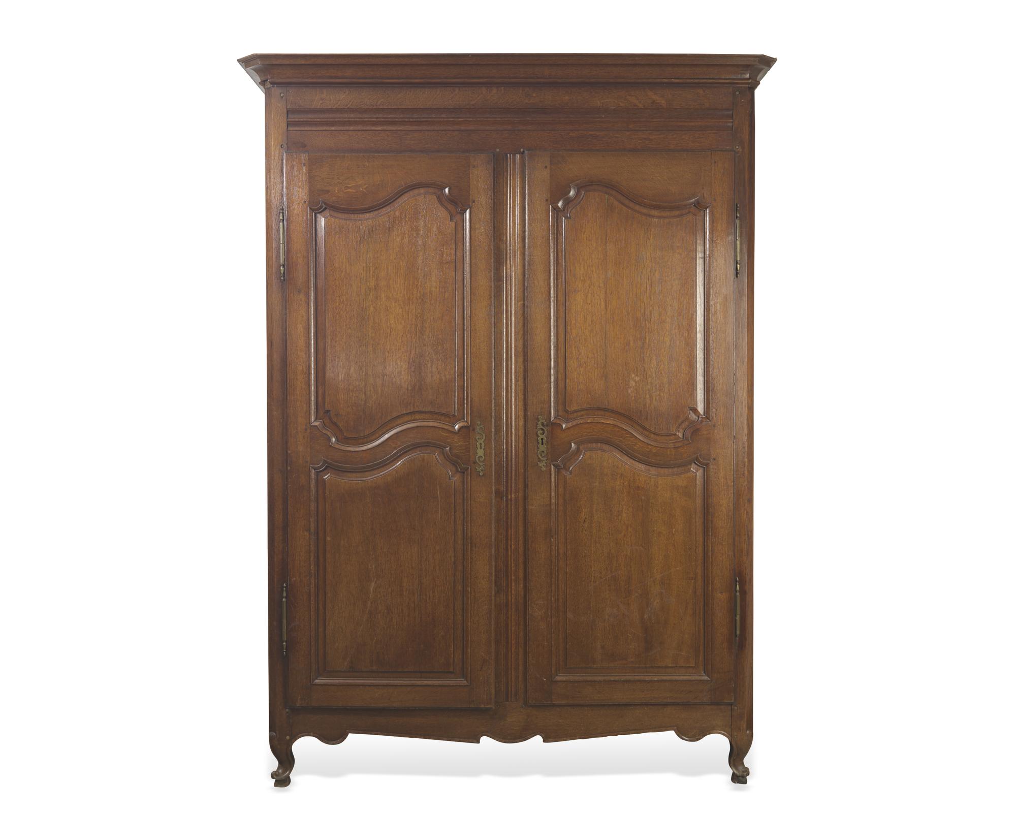 A Louis XVI carved oak armoire, circa 1790-1800
