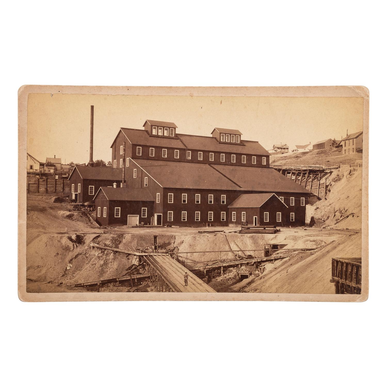 [MINING - NEVADA]. A group of 3 early mining images and a photograph booklet of mining activity in Virginia City, Goldfield, and Rawhide, Nevada, comprising: