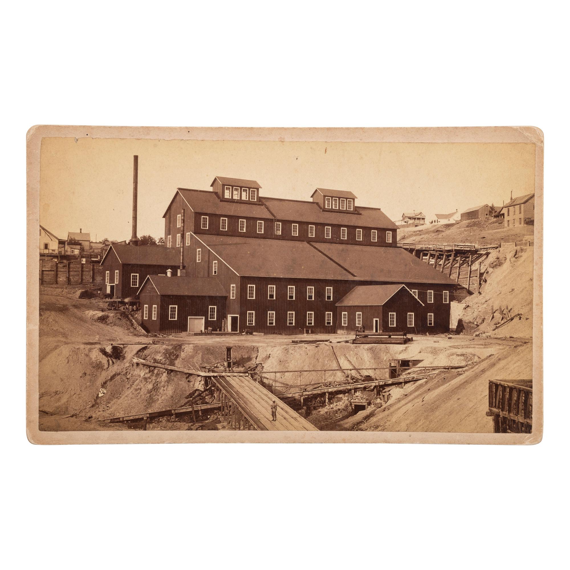 [MINING - NEVADA]. A group of 3 early mining images and a photograph booklet of mining activity in Virginia City, Goldfield, and Rawhide, Nevada, comprising: