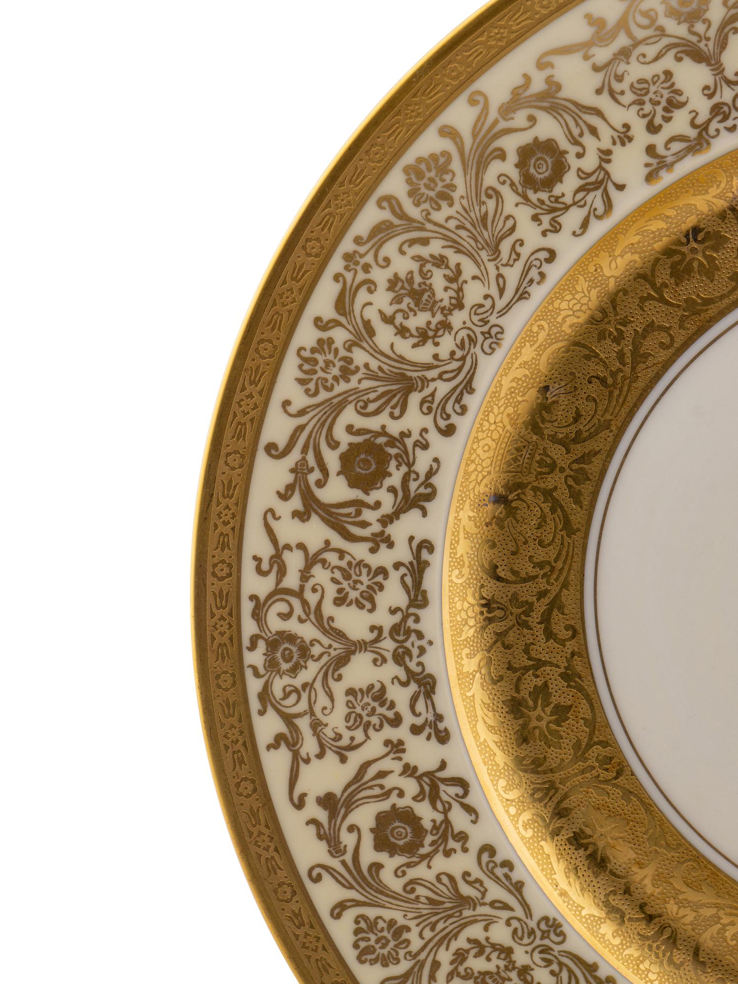 A Set of Twelve Bavarian Gilt Decorated Porcelain Plates