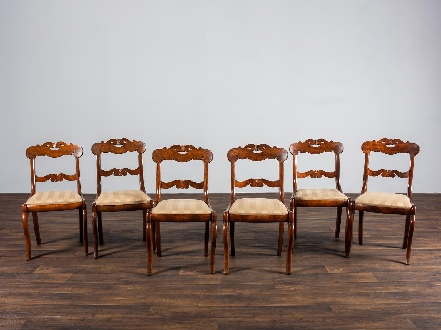 A Set of Six Classical Carved Walnut Dining Chairs