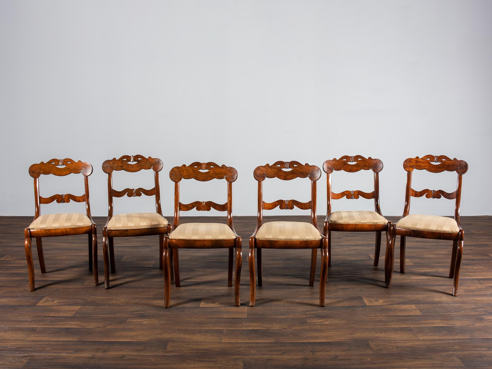 A Set of Six Classical Carved Walnut Dining Chairs