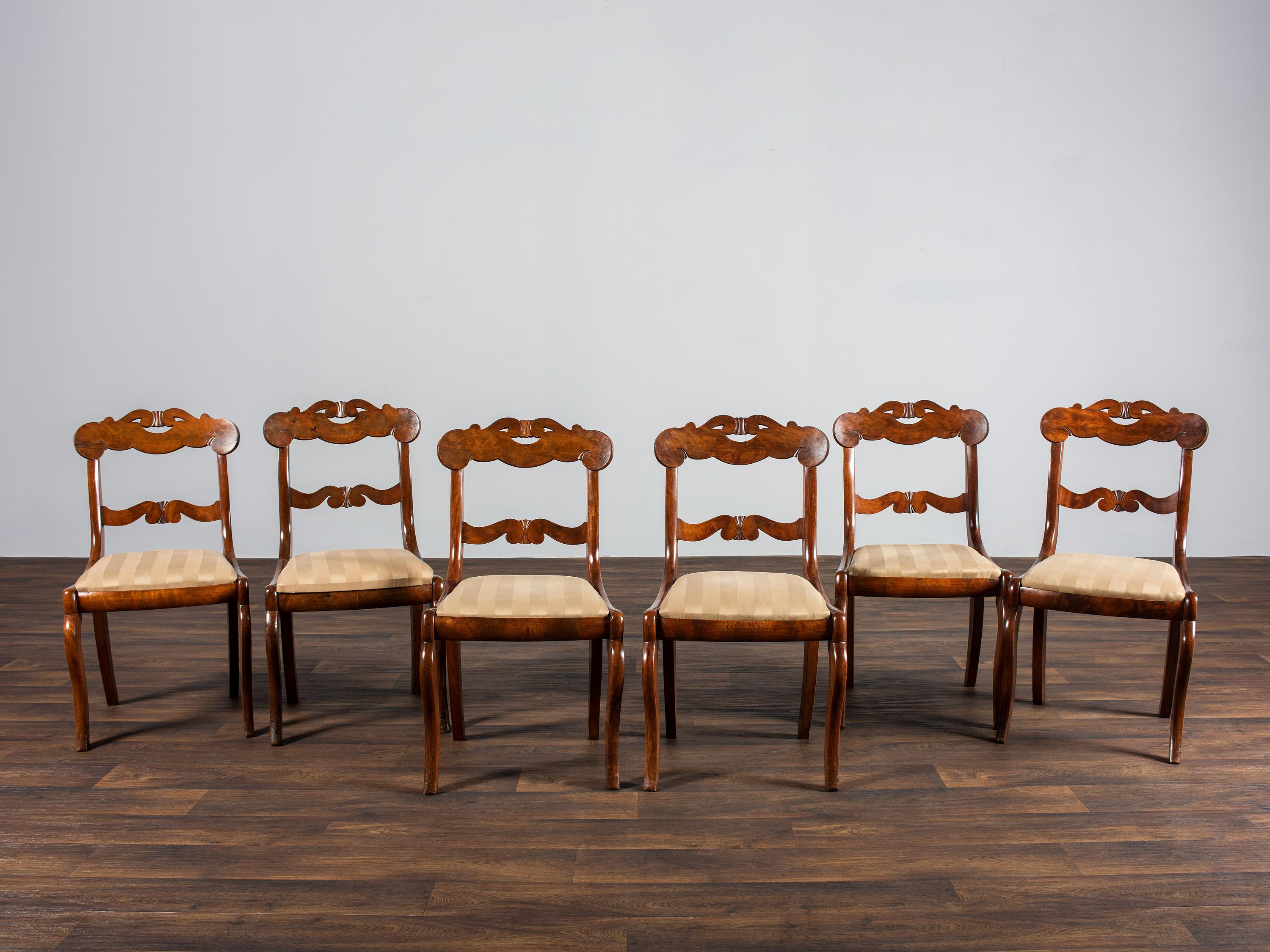 A Set of Six Classical Carved Walnut Dining Chairs