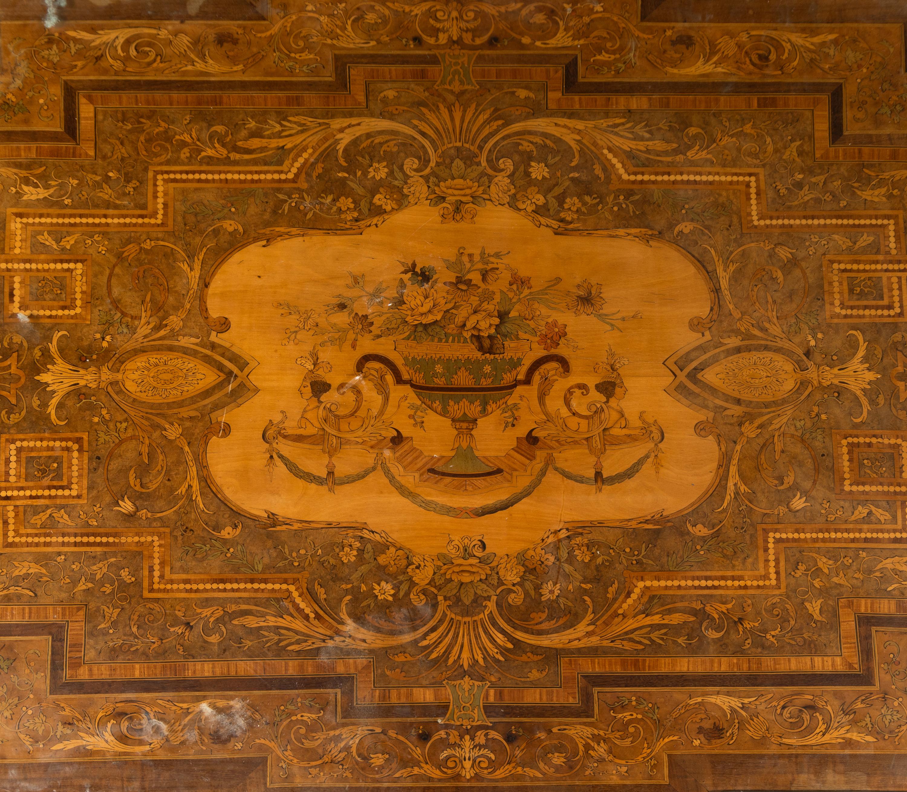 A Napoleon III Gilt Bronze Mounted Marquetry Center Table