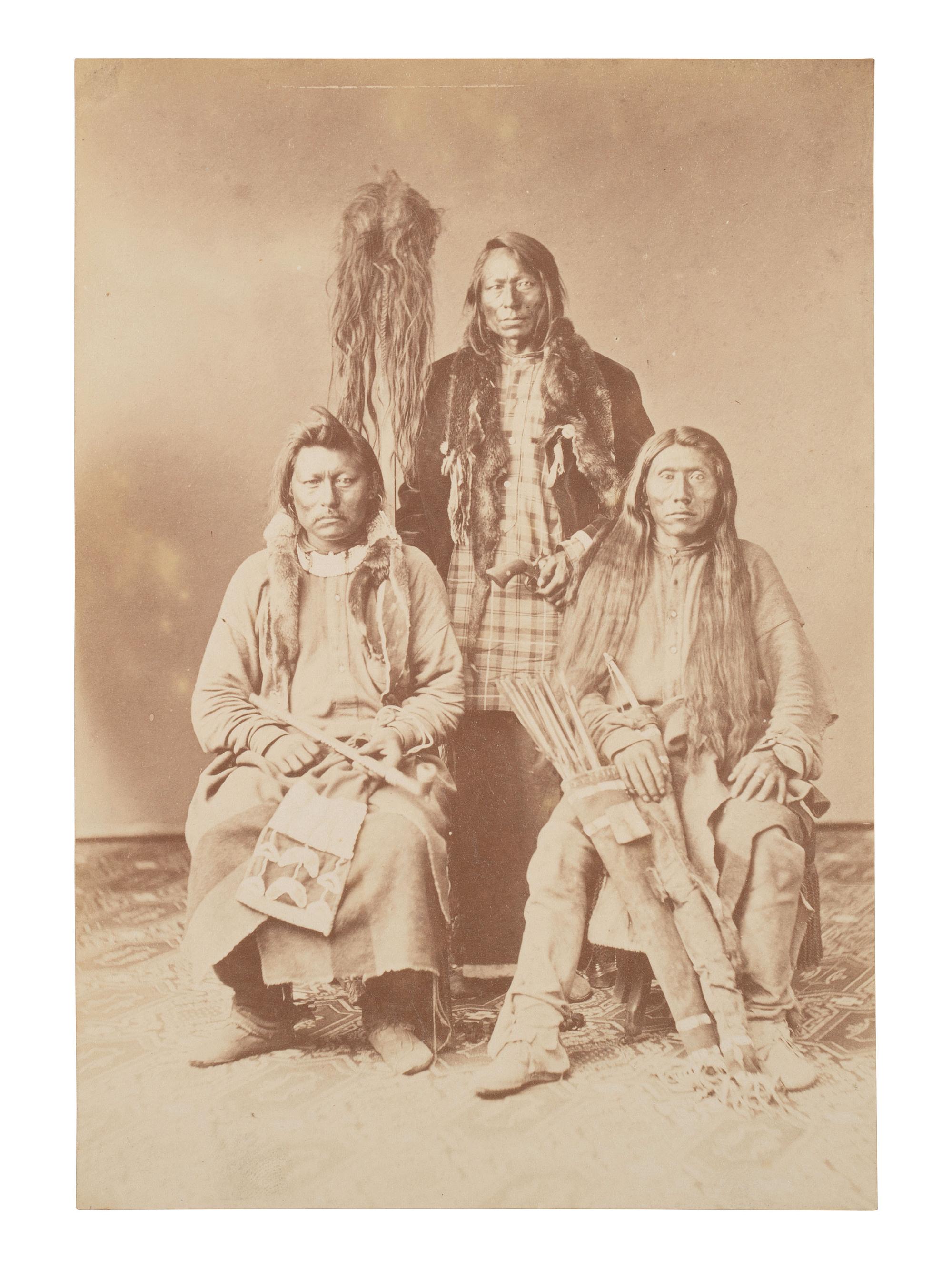 Johnson and Co. with Scalp . Albumen photograph of Ute Braves involved with the Battle of Milk Creek. Ca 1870s.