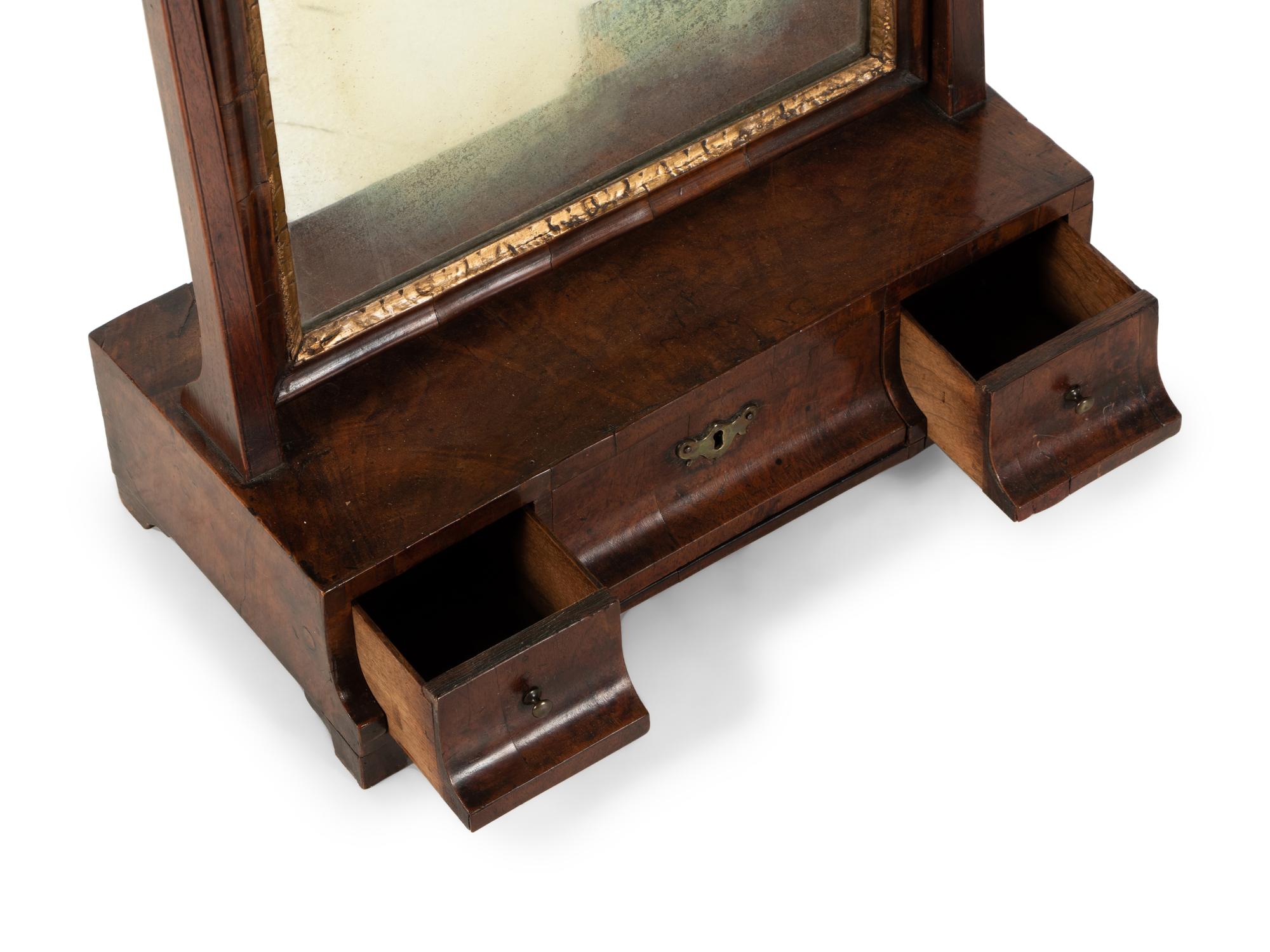 A George II Parcel Gilt Walnut Dressing Mirror