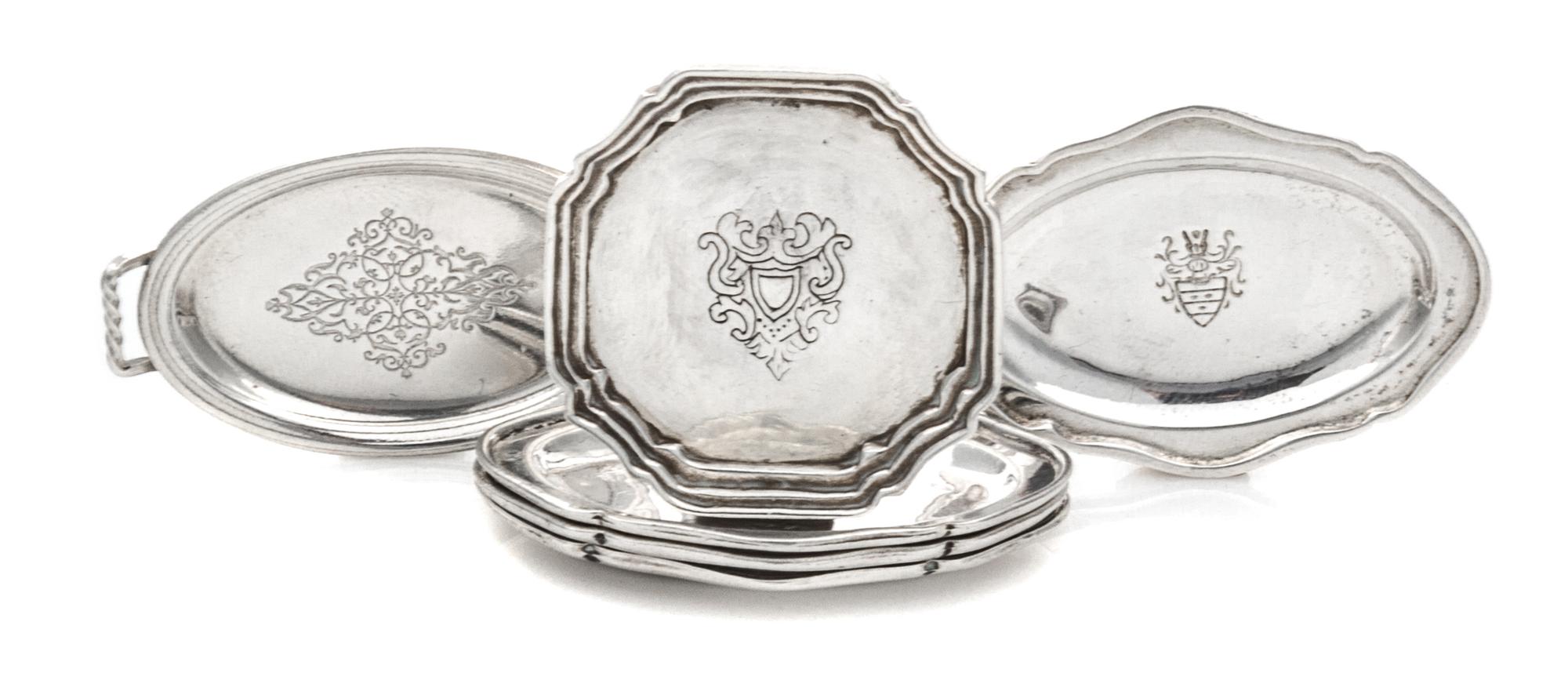 A Group of Six Silver Platters, , comprising a set of four examples of oval form with engraved decoration, together with a two-handled