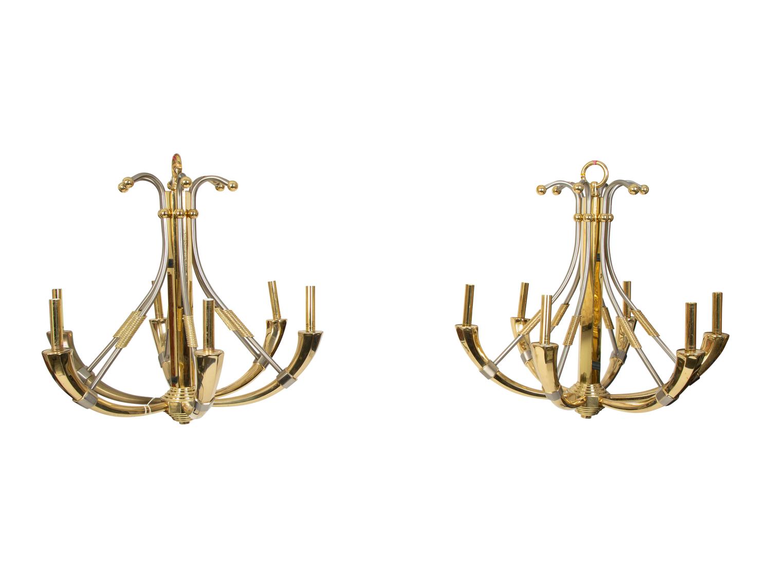 A Pair of Steel and Brass Chandeliers by Maison Jansen
