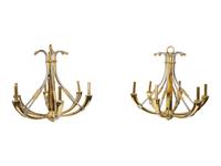 A Pair of Steel and Brass Chandeliers by Maison Jansen
