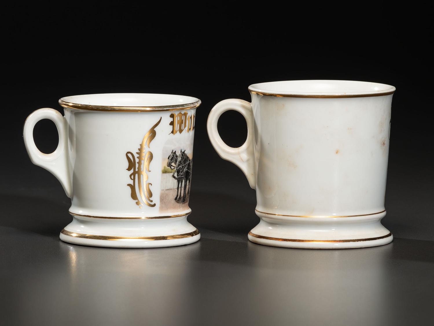 Two Porcelain Shaving Mugs Featuring Horse-Drawn Hearses