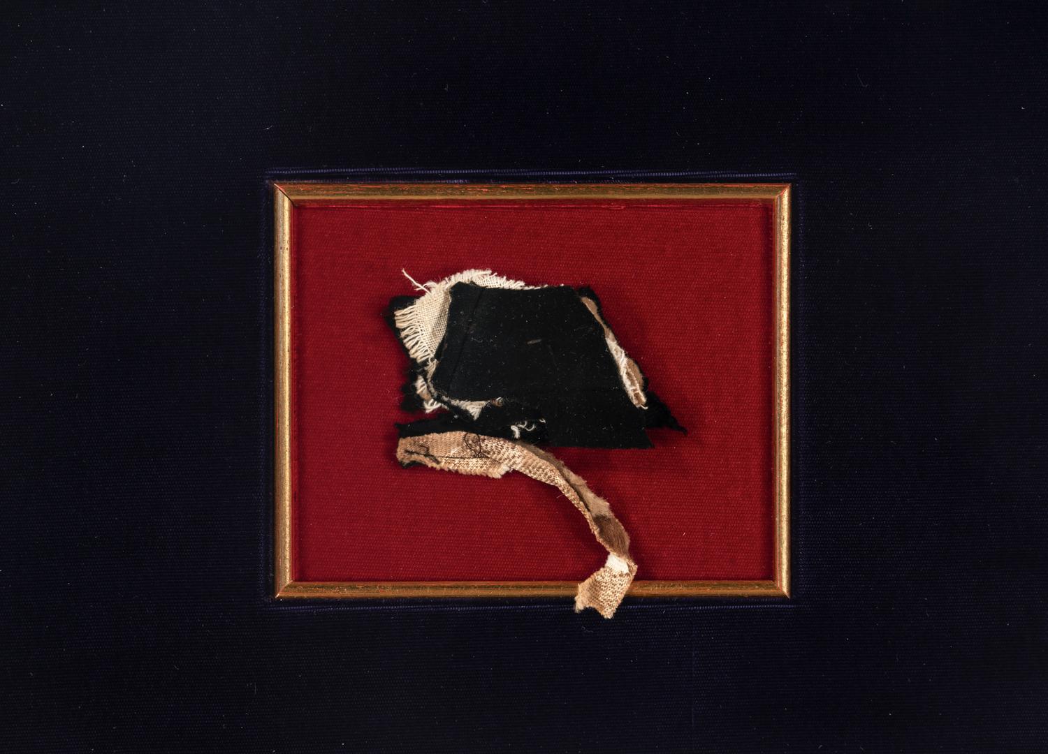 [LINCOLN ASSASSINATION]. A piece of President Abraham Lincoln's coat worn on the night of his assassination at Ford's Theatre, 14 April 1865.