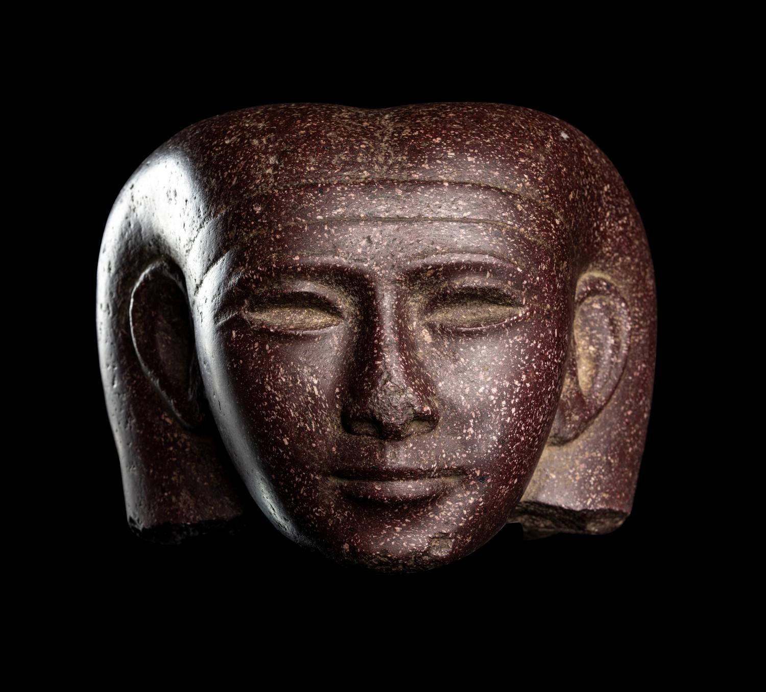 A Roman Porphyry Head of an Egyptian Woman