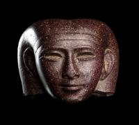 A Roman Porphyry Head of an Egyptian Woman