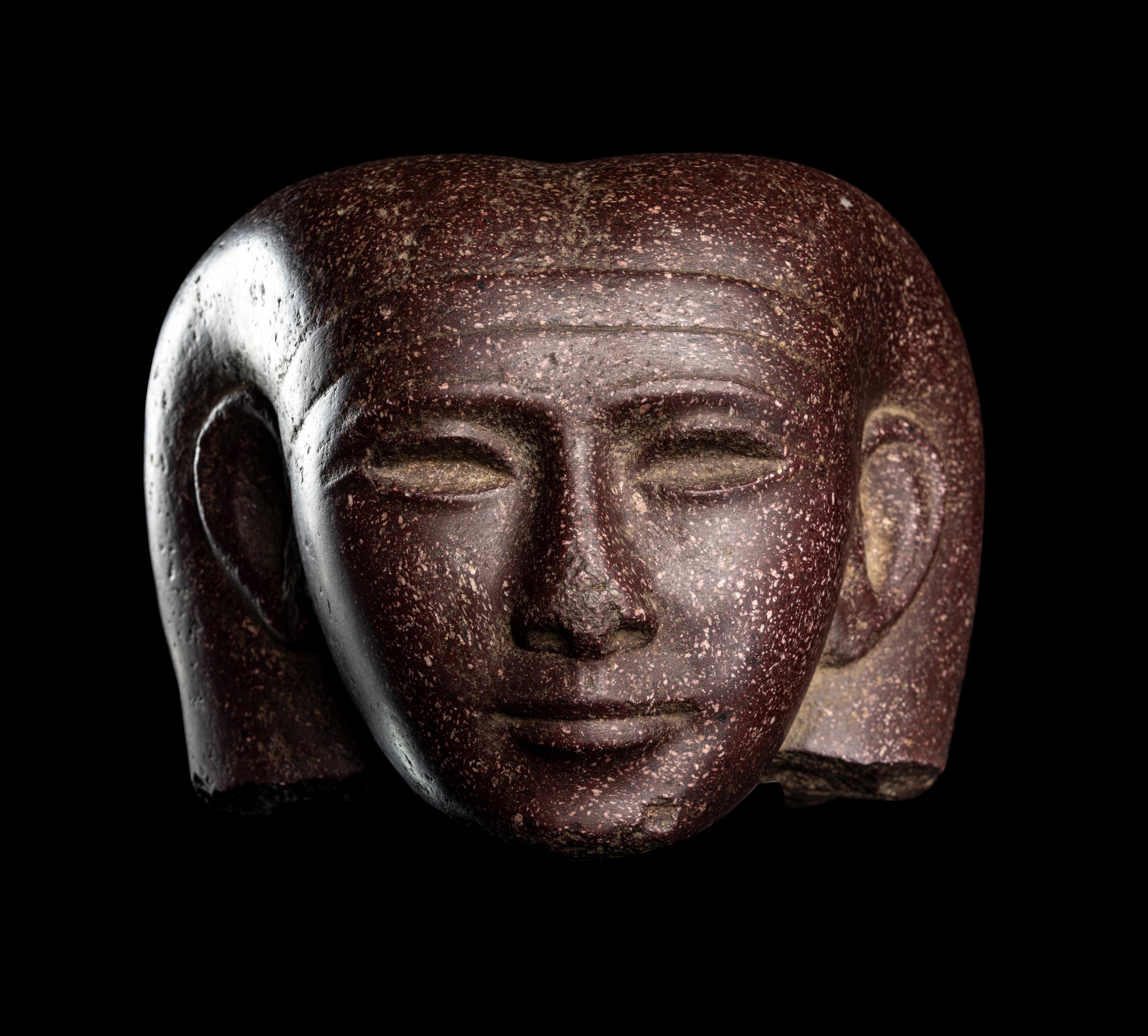 A Roman Porphyry Head of an Egyptian Woman