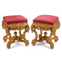 A Pair of Régence Style Carved Giltwood Stools