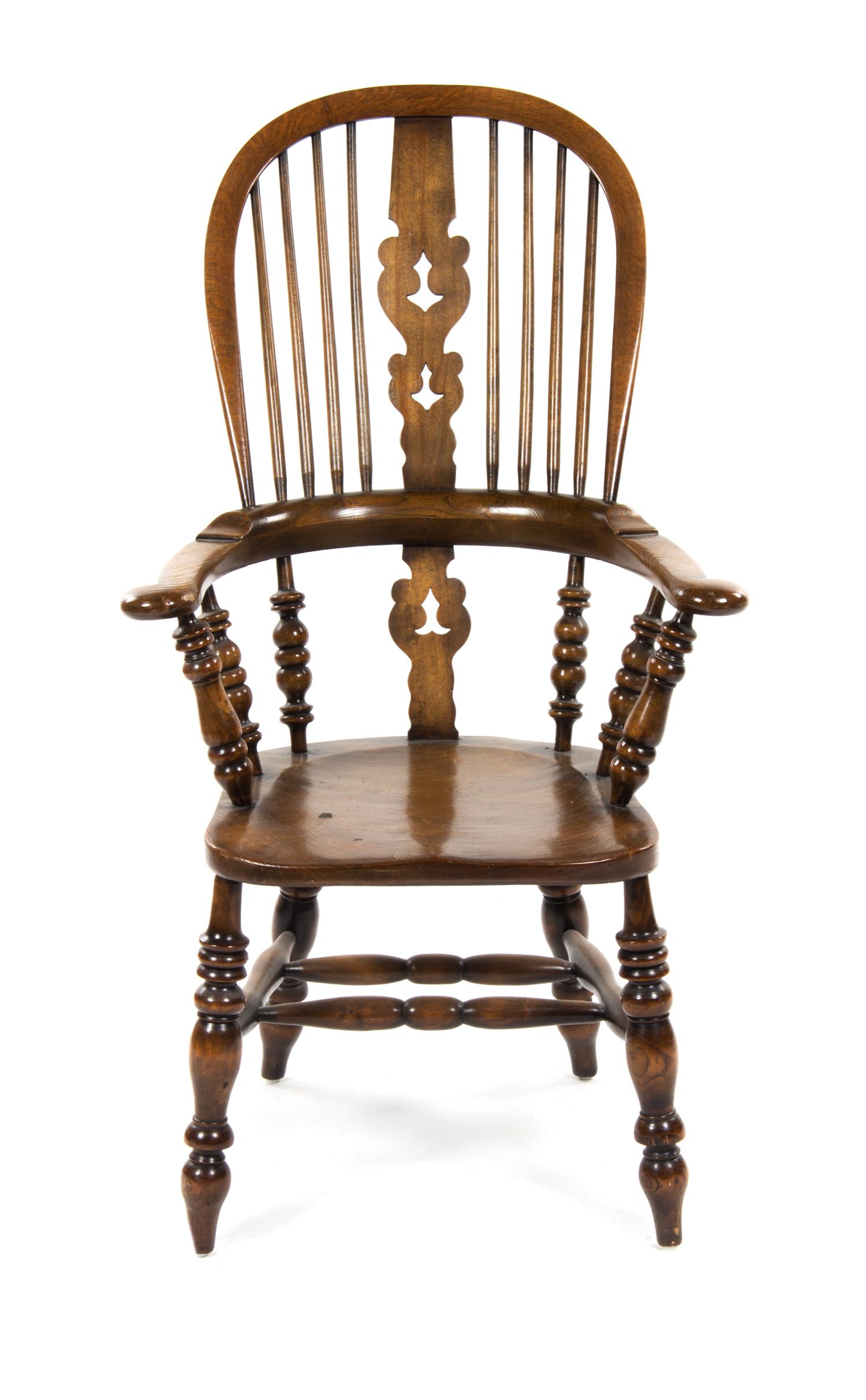 An English Walnut Windsor Chair, Height 45 1/2 inches.