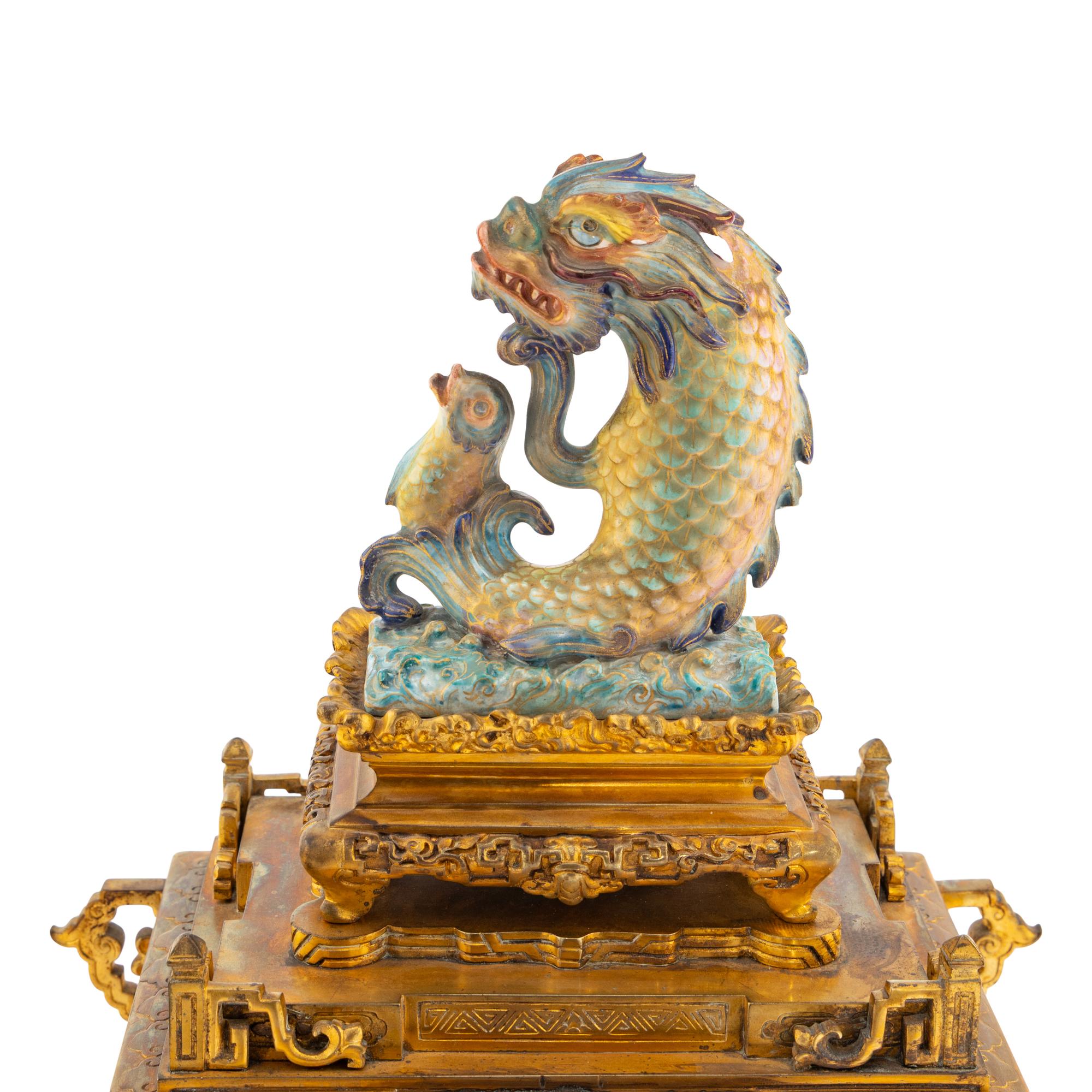 A French "Japonisme" Gilt Bronze and Porcelain Mounted Clock