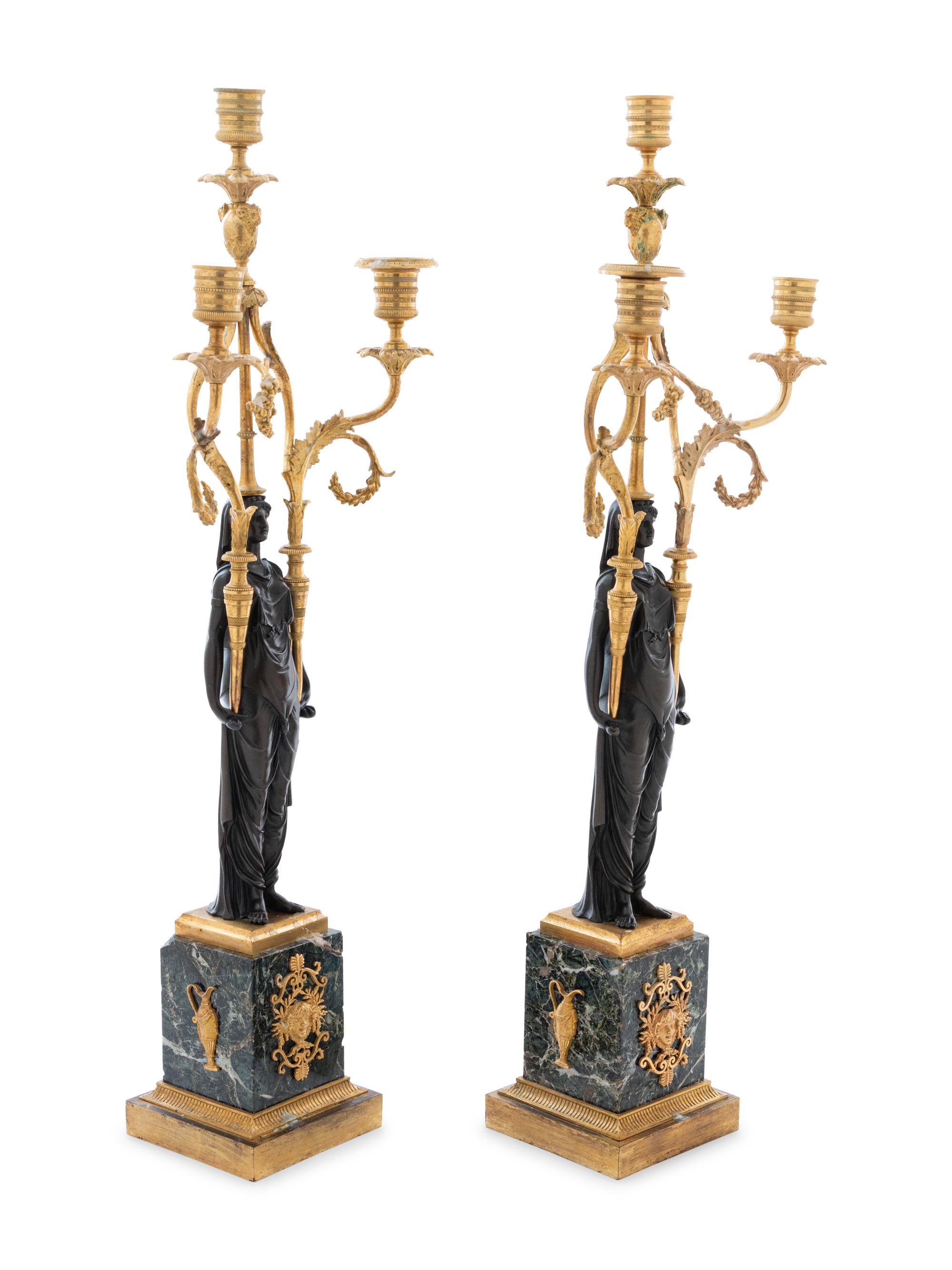 A Pair of Empire Gilt and Patinated Bronze and Marble Three-Light Figural Candelabra