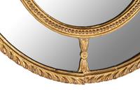 A Near Pair of George III Giltwood Oval Mirrors