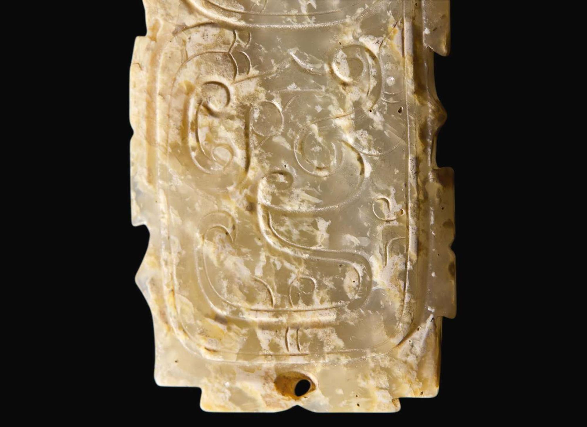 A Chinese "Dragon and Phoenix" calcified jade fitting, probably Western Zhou 龍鳳紋玉牌飾 或西周