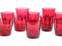 A Set of Sixteen Hermès Attelage Pink Glass Tumblers