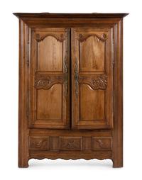 A French Carved Walnut Armoire