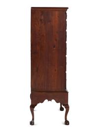 A Chippendale Carved and Figured Walnut Chest on Claw-and-Ball Foot Stand