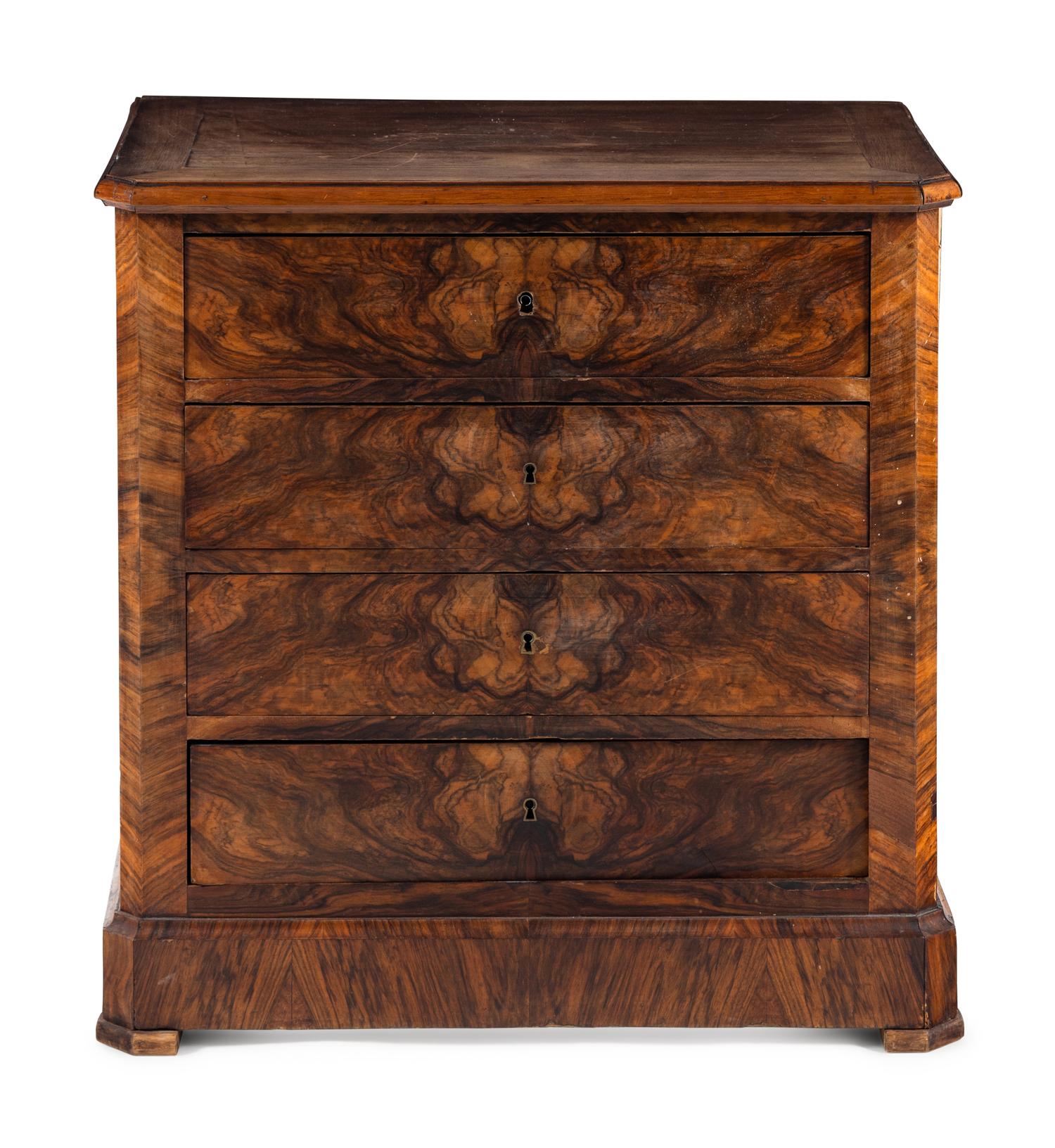 A Continental Figured Walnut Chest of Drawers