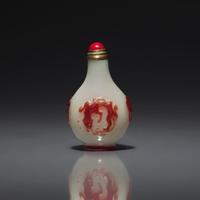 A Chinese Miniature Red-Overlaid Opaline Glass Snuff Bottle, Circa 1750-1820 1750-1820年 涅白地套寶石紅料螭龍紋小鼻烟壺