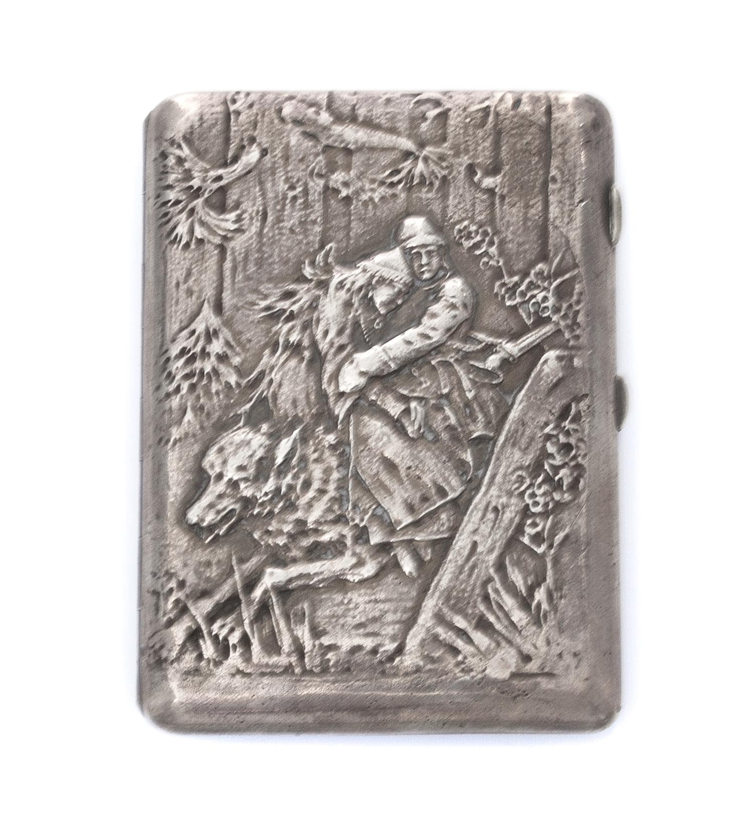 A Ukrainian Silver Cigarette Case, Maker's mark Cyrillic 4YuK, Kiev, of rectangular form, the lid worked to show a man and woman riding